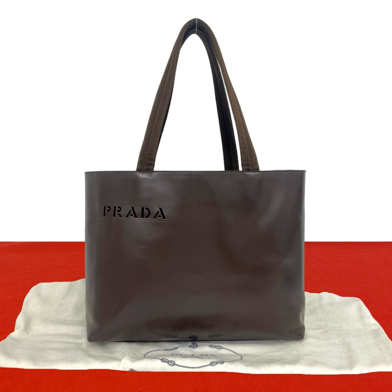 PRADA プラダ カットアウト ロゴ レザー トートバッグ ブラウン
52987