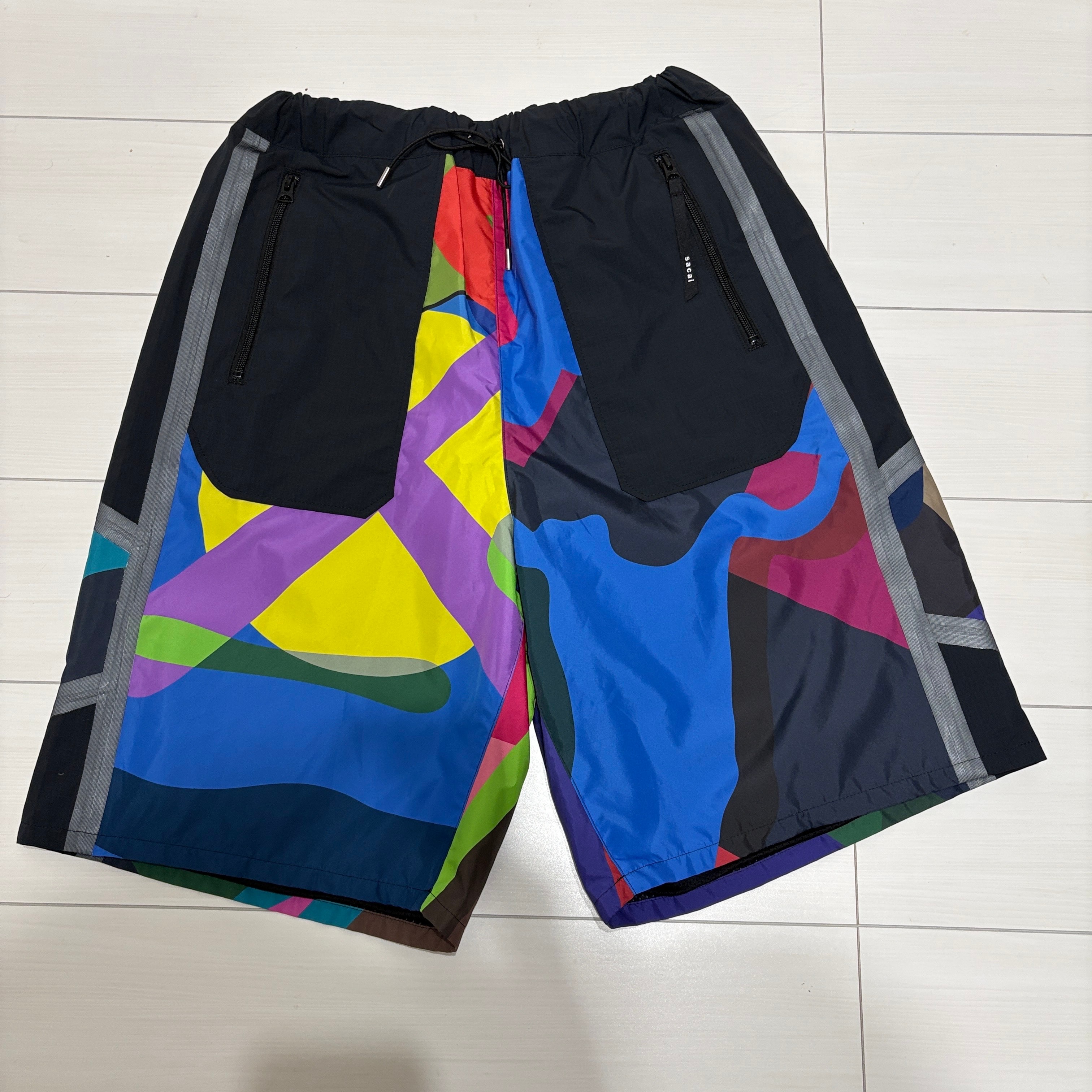 sacai KAWS Track Shorts "Multi"
