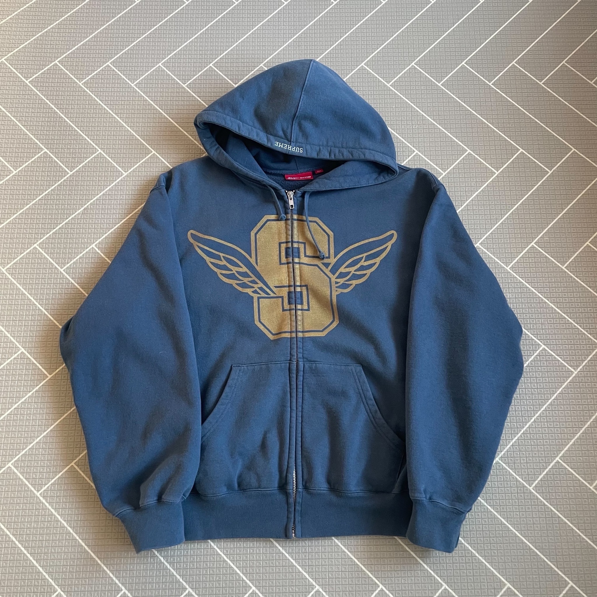 シュプリーム ウィング ジップアップ フーディー スウェットシャツ "ネイビー"