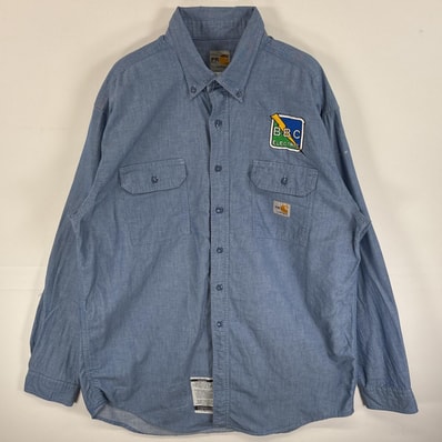 古着 カーハート Carhartt 長袖シャツ ワンポイント ロゴ 耐火素材 フラップポケ ブルー系 無地 メンズ