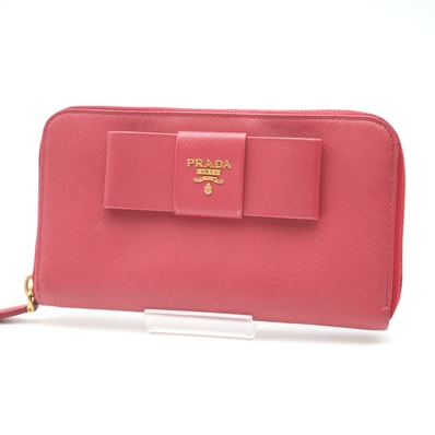 PRADA(プラダ)フィオッコ ラウンドファスナー長財布 リボン サフィアーノレザー フューシャピンク ゴールド金具 レディース【中古】