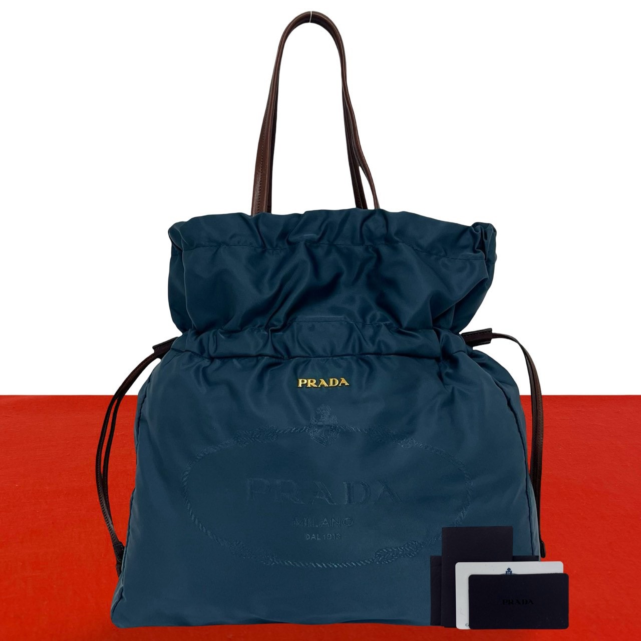 PRADA プラダ ロゴ 金具 ナイロン レザー トートバッグ ブルー
63021