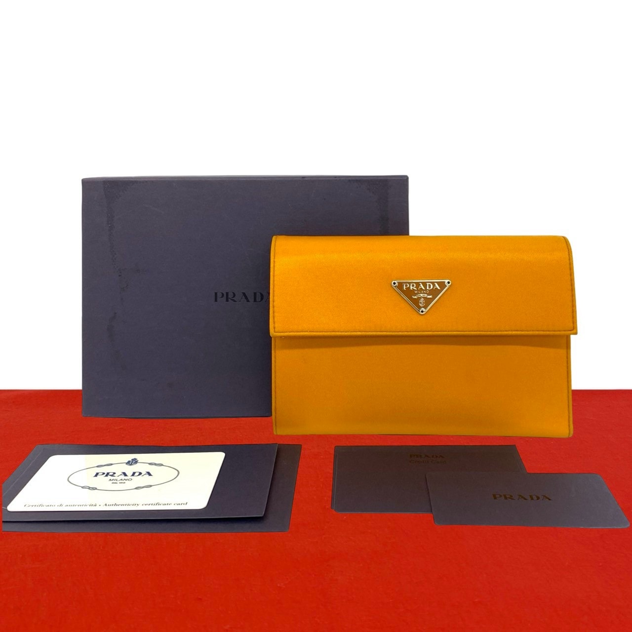 PRADA プラダ 三角ロゴ 金具 ナイロン 二つ折り財布 オレンジ
 31807