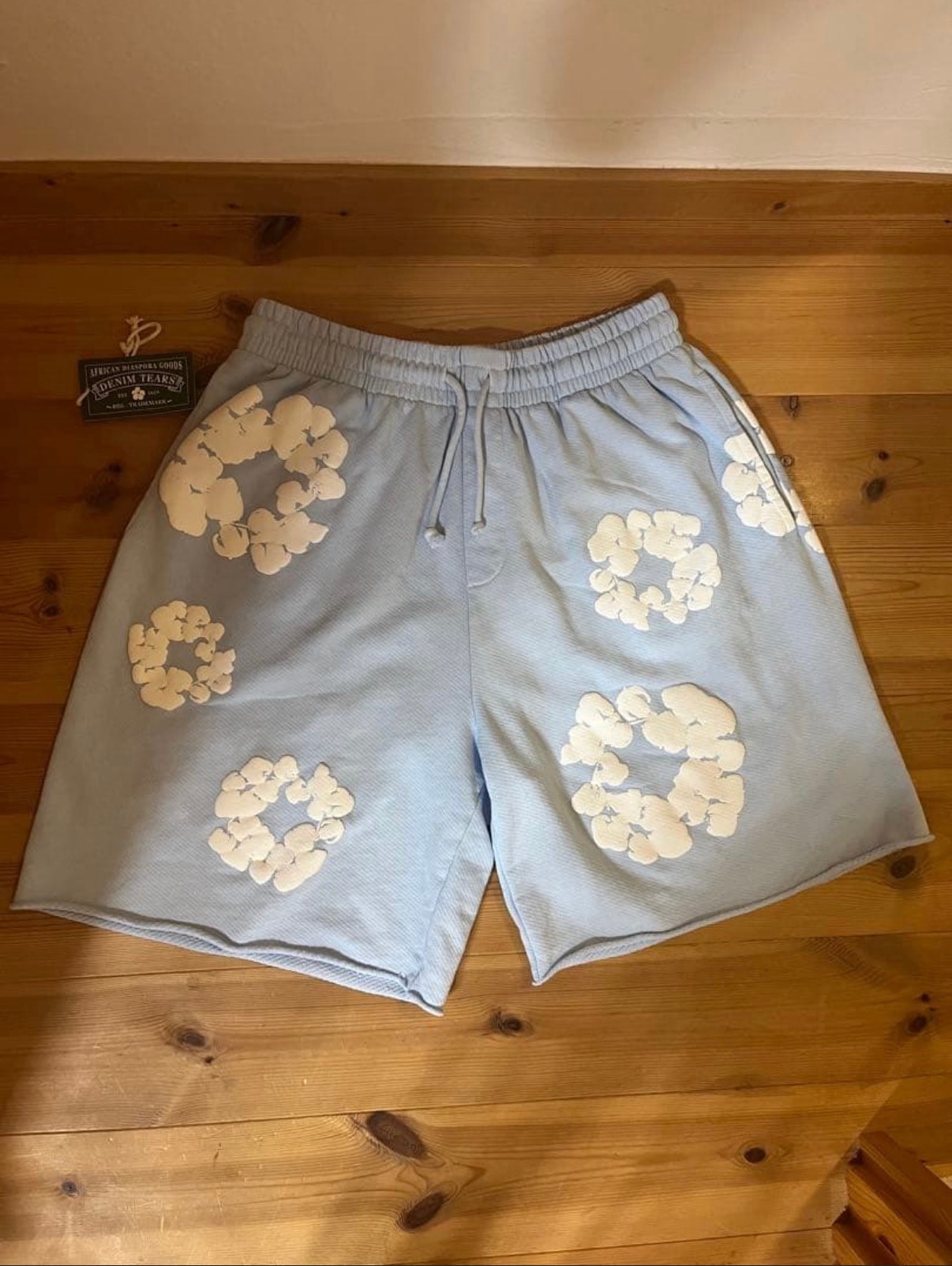 DENIM TEARS Cotton Wreath Sweatshorts "Powder Blue"