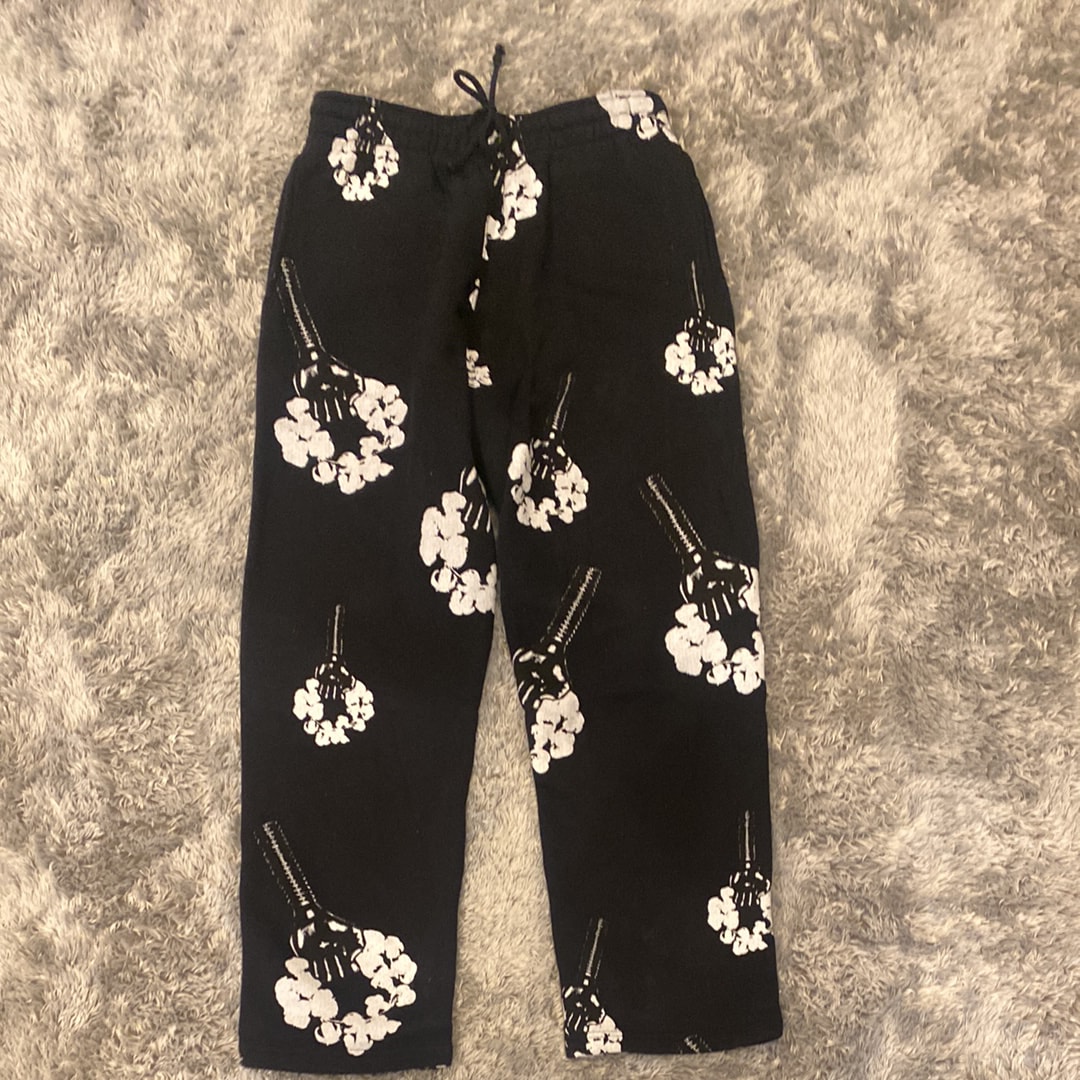 DENIM TEARS Hardies Tears Fist Wreath Open Hem Sweatpants "Black"