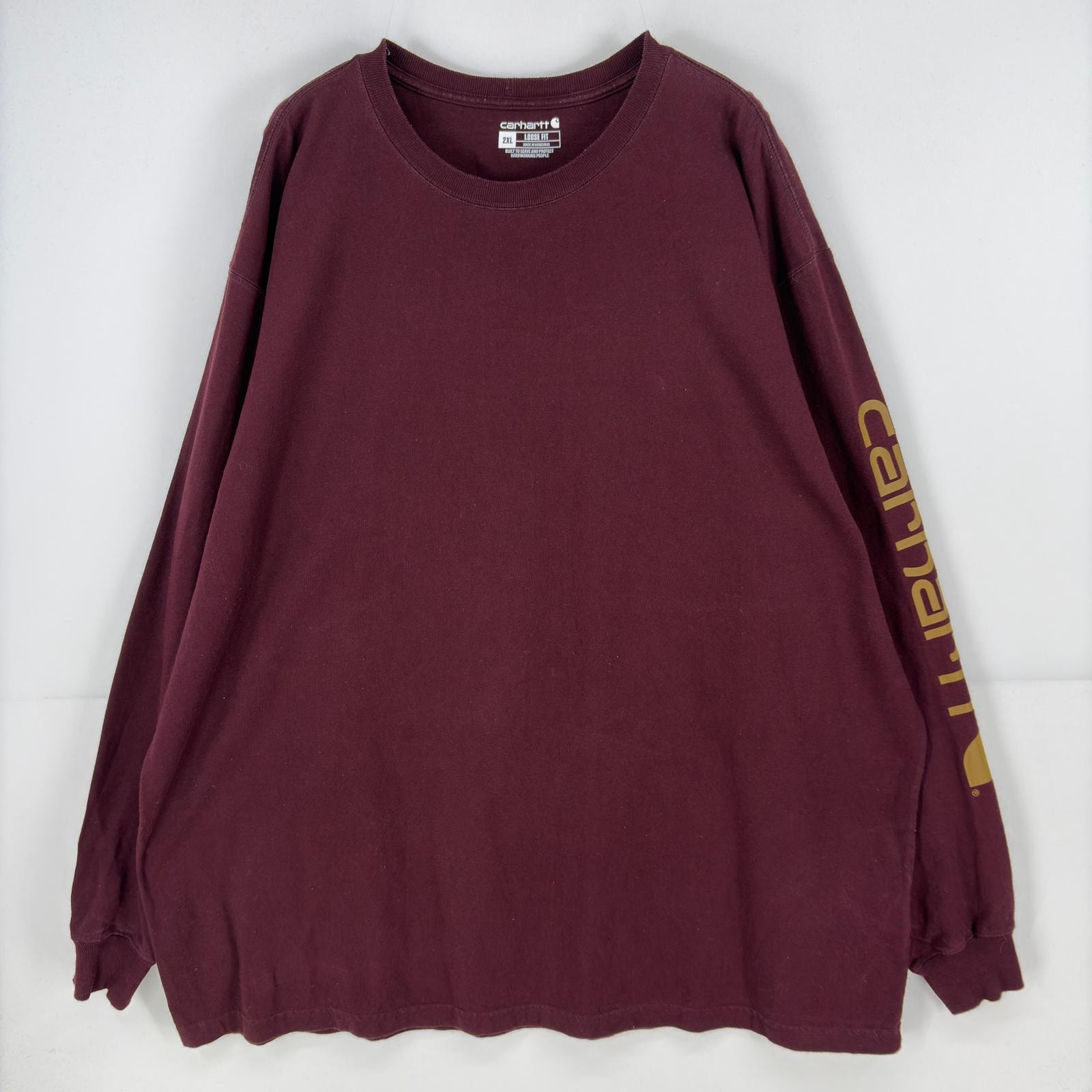 古着 カーハート Carhartt 長袖Tシャツ クルーネック 大きいサイズ ルーズフィット 袖プリント ロゴ プリント 2XL  レッド系 メンズ