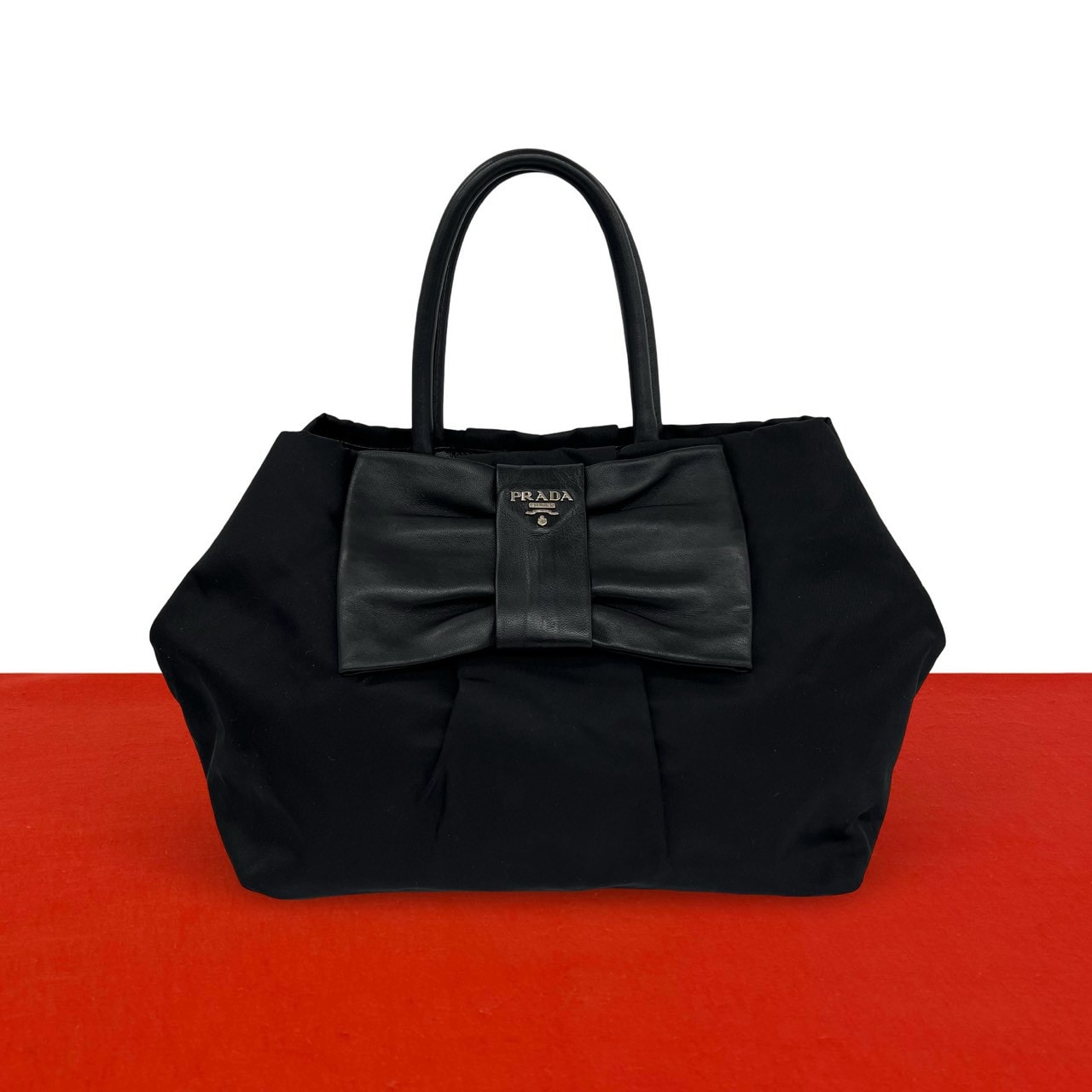 PRADA プラダ ロゴ 金具 ナイロン レザー ハンドバッグ ブラック
 97695