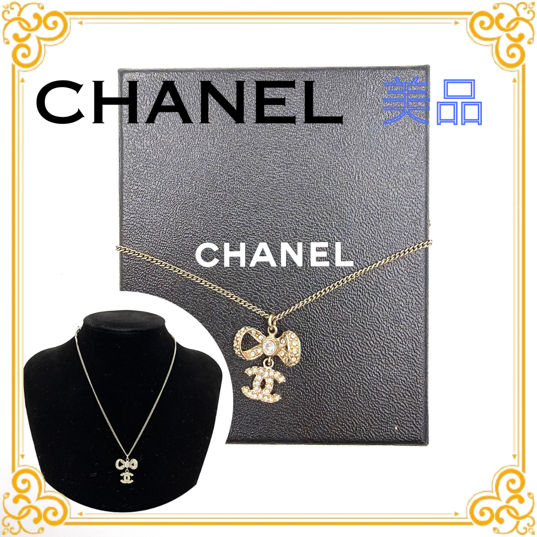 CHANEL Coco Mark Rhinestone Ribbon Necklace "Gold"