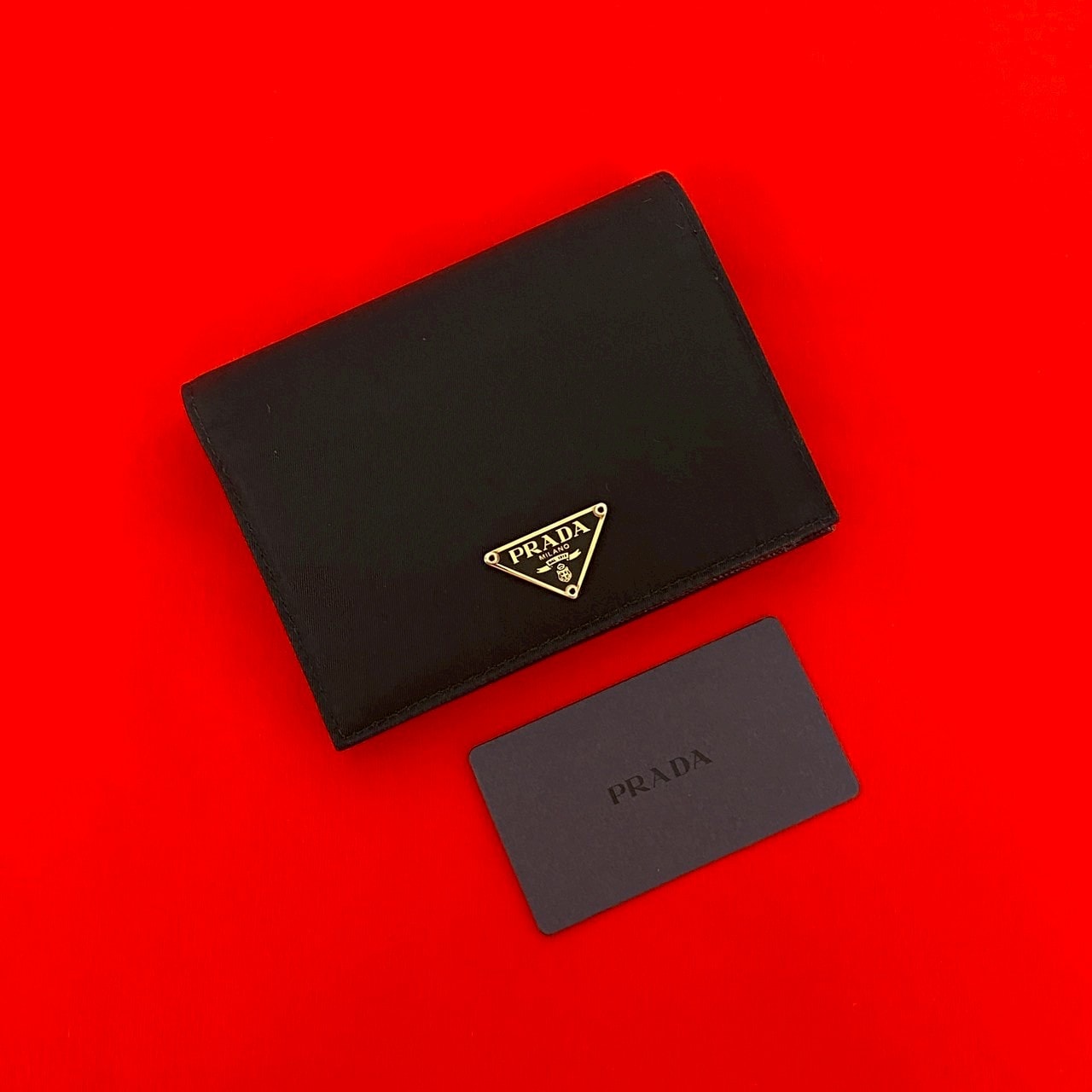 PRADA プラダ 三角ロゴ 金具 ナイロン レザー 二つ折り財布 ブラック
62673