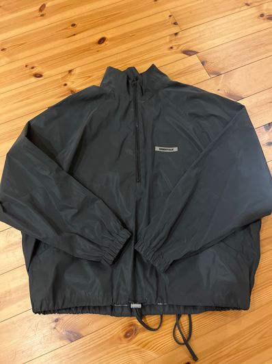 FEAR OF GOD ESSENTIALS Half Zip Track Jacket "Black Reflective"