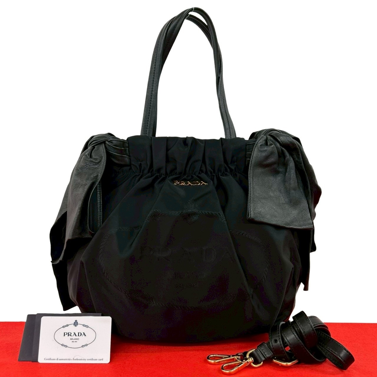 PRADA プラダ ロゴ 金具 リボン ナイロン レザー ショルダーバッグ ブラック
 92702