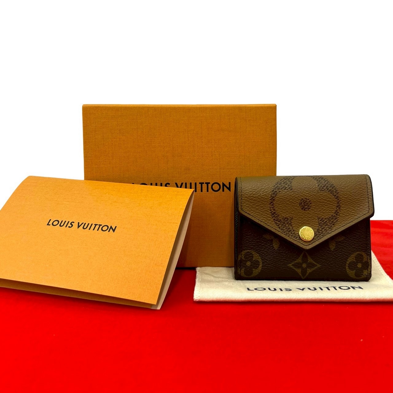 LOUIS VUITTON ルイヴィトン ポルトフォイユ・ゾエ モノグラム ジャイアント リバース レザー 二つ折り財布 ブラウン
 27410