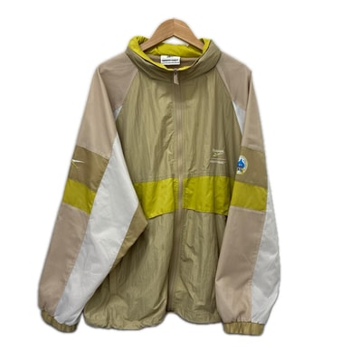 REEBOK リーボック ジャケット ナイロンジャケット SIZE XL ドラゴンクエスト 40周年 RB00160 ベージュ系 x イエロー x ホワイト