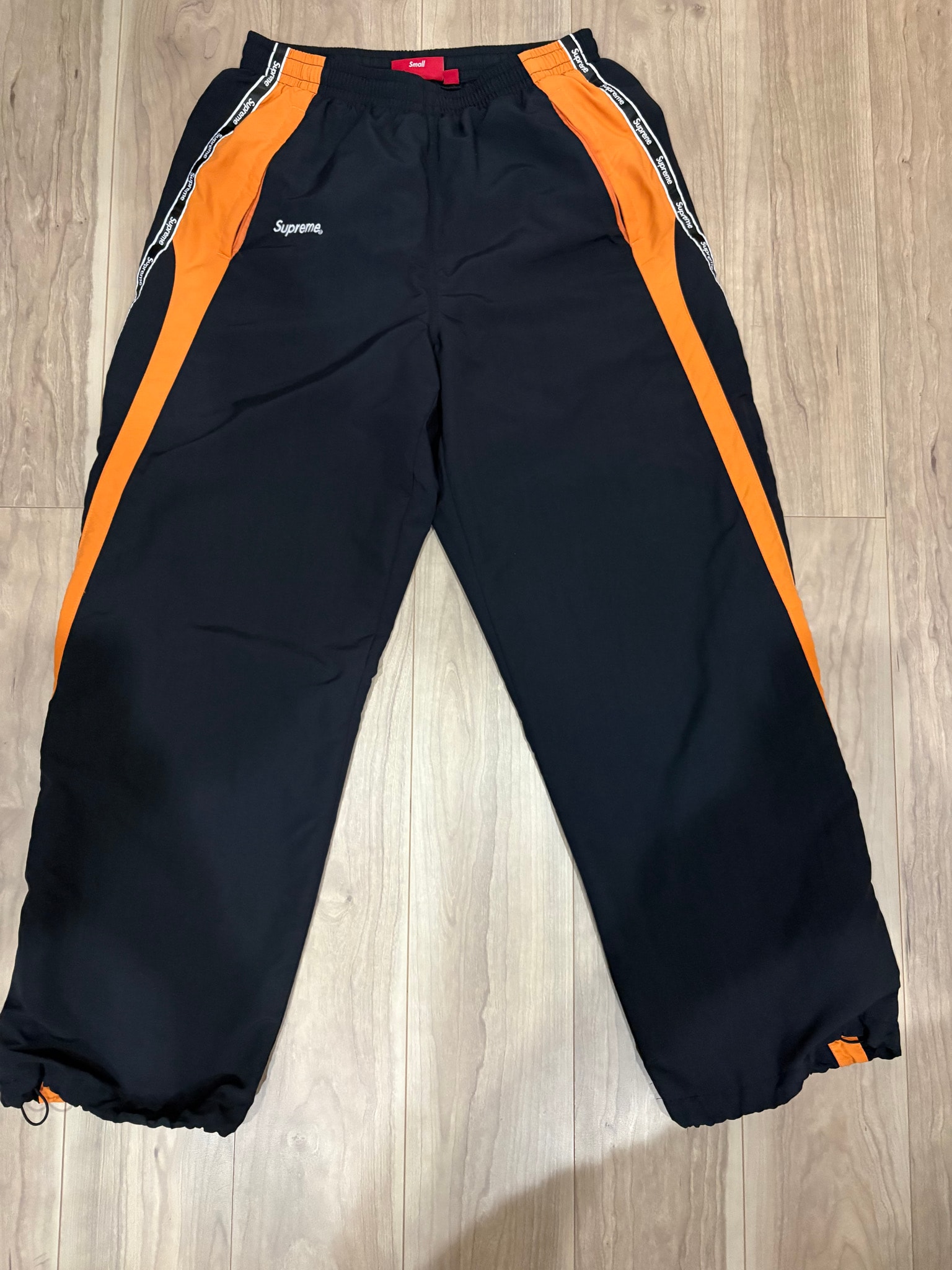 Supreme Logo Taping Track Pant "Orange"