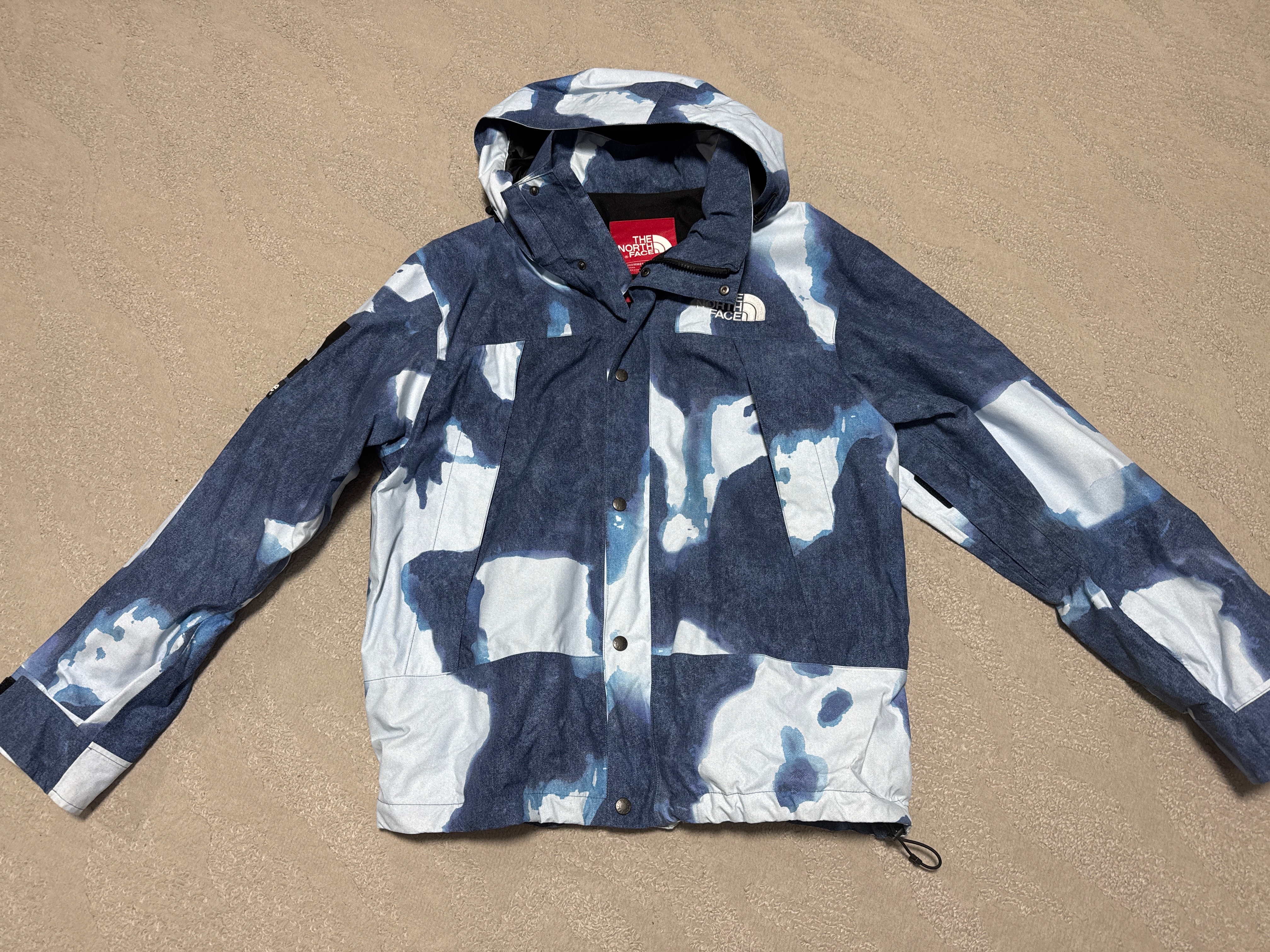 Supreme x The North Face Bleached Denim Print Mountain Jacket