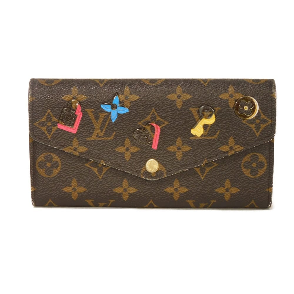 LOUIS VUITTON ルイ・ヴィトン ポルトフォイユ サラ LVロゴ フラワー パドロック キー スナップボタン 札入れ カードケース コインケース 二つ折り モノグラム ラブロック ホットピンク 長財布 M64117
