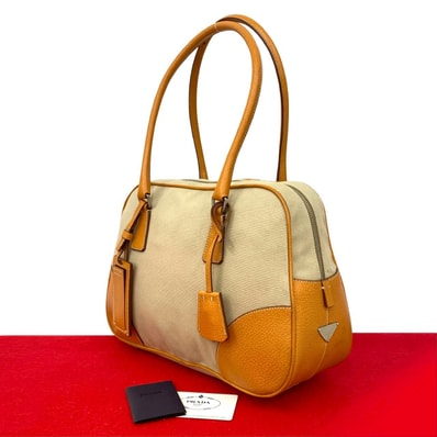 PRADA プラダ 三角ロゴ 金具 レザー キャンバス トートバッグ ベージュ
2148a