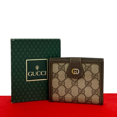 GUCCI グッチ GG ロゴ 金具 キャンバス レザー 二つ折り財布 ブラウン
33572