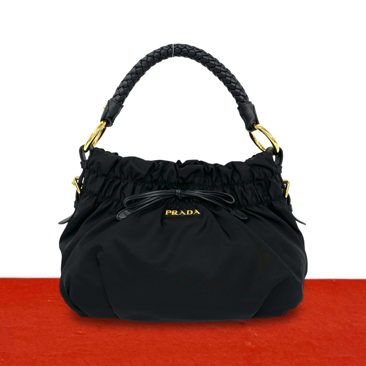 PRADA プラダ ロゴ 金具 リボン モチーフ ナイロン レザー ハンドバッグ ブラック
 30090