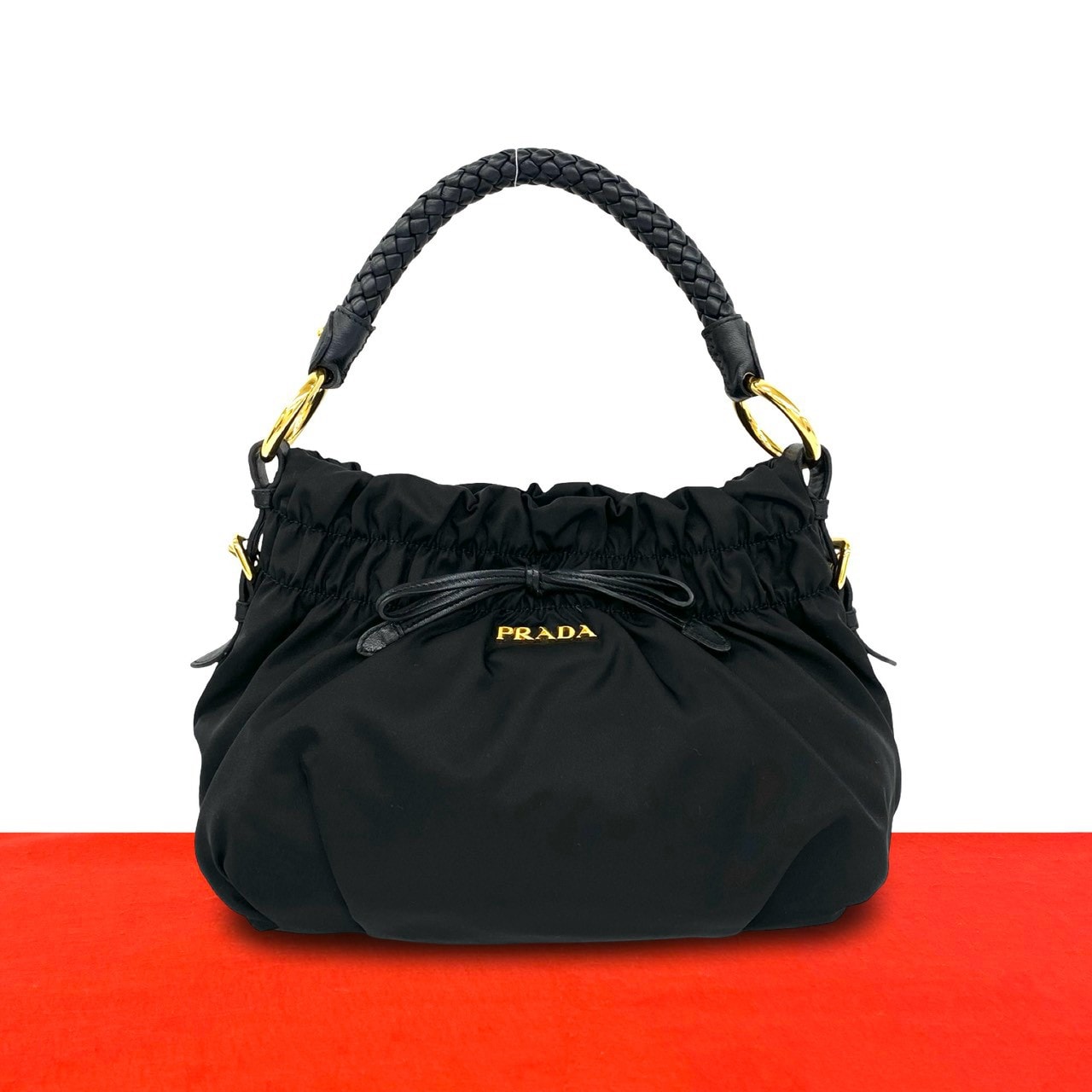 PRADA プラダ ロゴ 金具 リボン モチーフ ナイロン レザー ハンドバッグ ブラック
30090