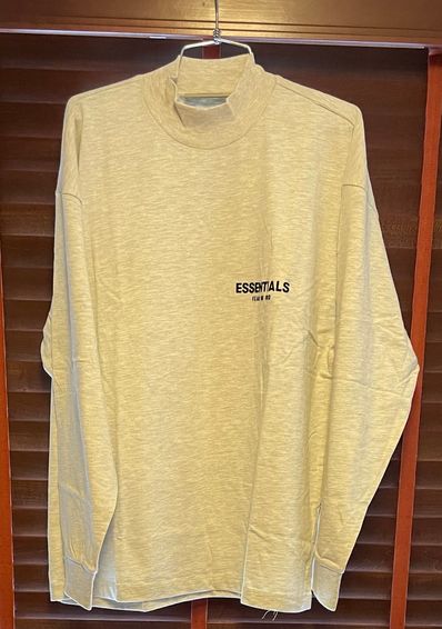 FEAR OF GOD ESSENTIALS BLACK ESS LOGO LS TEE "Light Oatmeal"