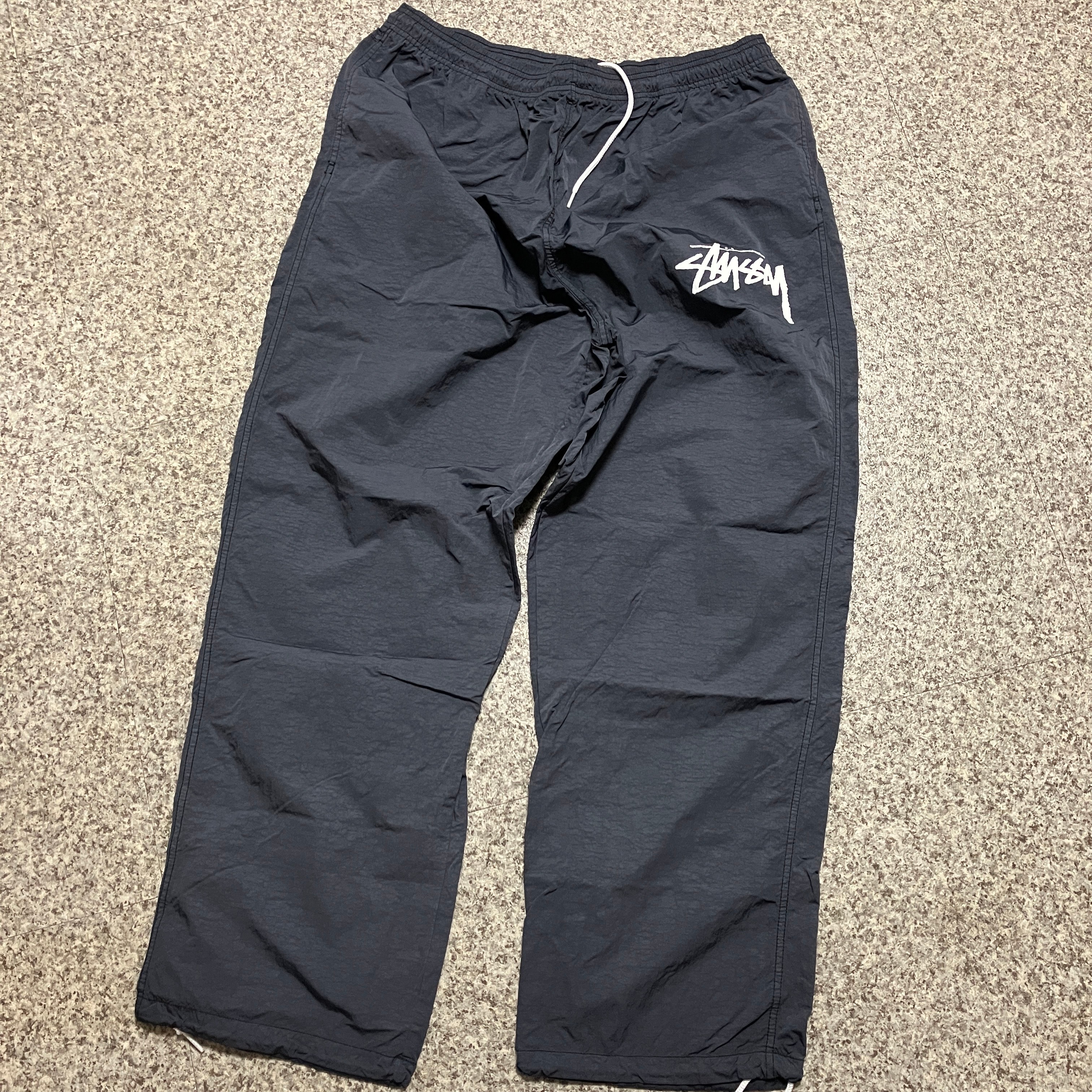 ナイキ ステューシー ビーチ パンツ "オフノワール"