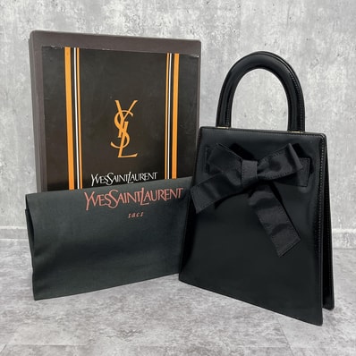 【Yves Saint Laurent】イヴサンローラン ハンドバッグ 箱・保存袋付き リボン レザー ブラック 黒 レディース 日本製 フォーマル 手提げ