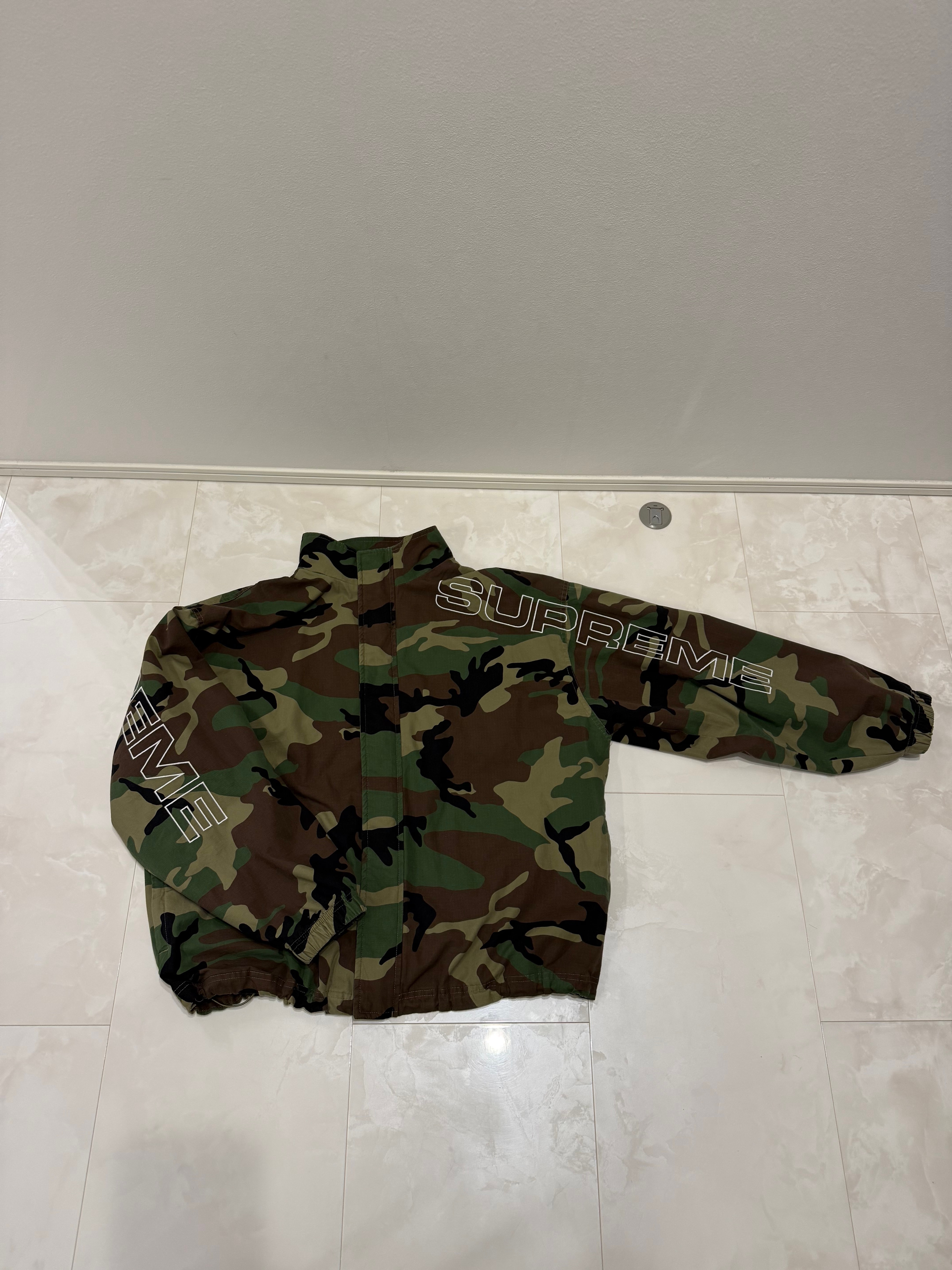 Supreme Spellout Embroidered Ripstop Track Jacket "Woodland Camo"