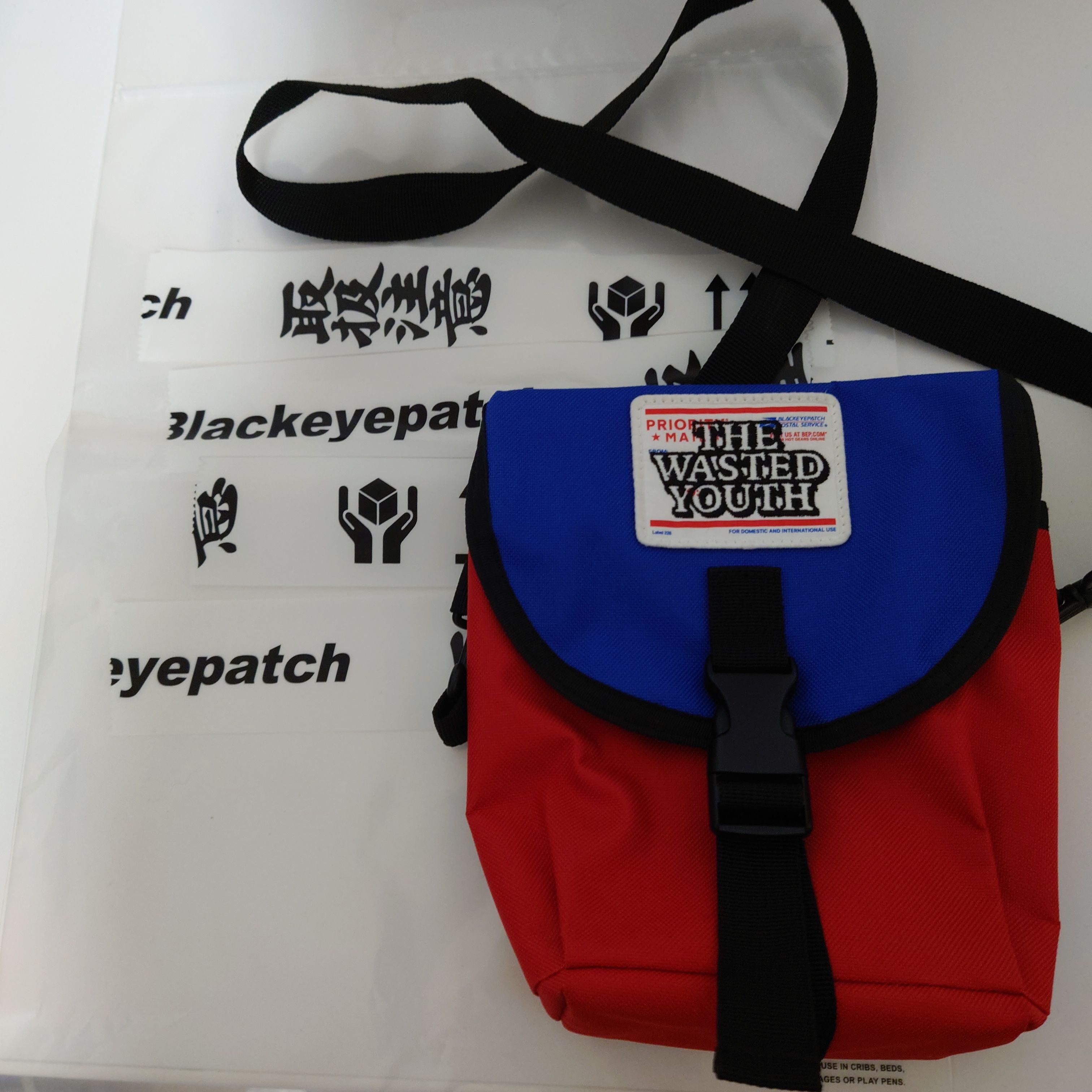 BlackEyePatch x Wasted Youth PRIORITY LABEL SHOULDER BAG "Blue/Red" / VERDY