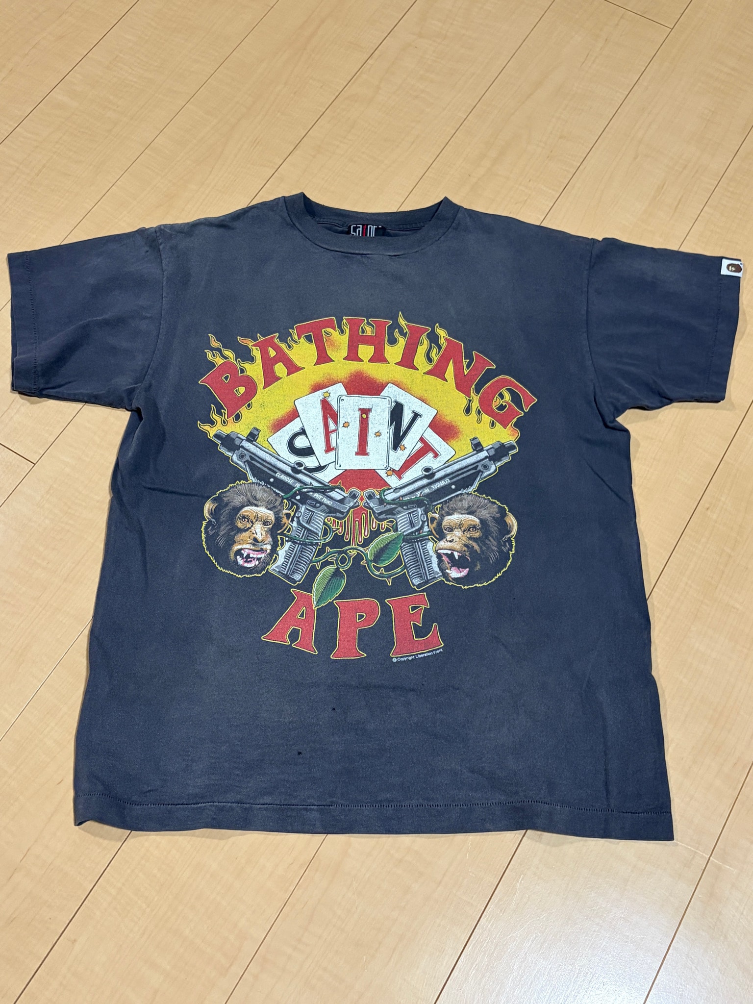 SAINT Mxxxxxx x A BATHING APE Guns Tee "Charcoal"