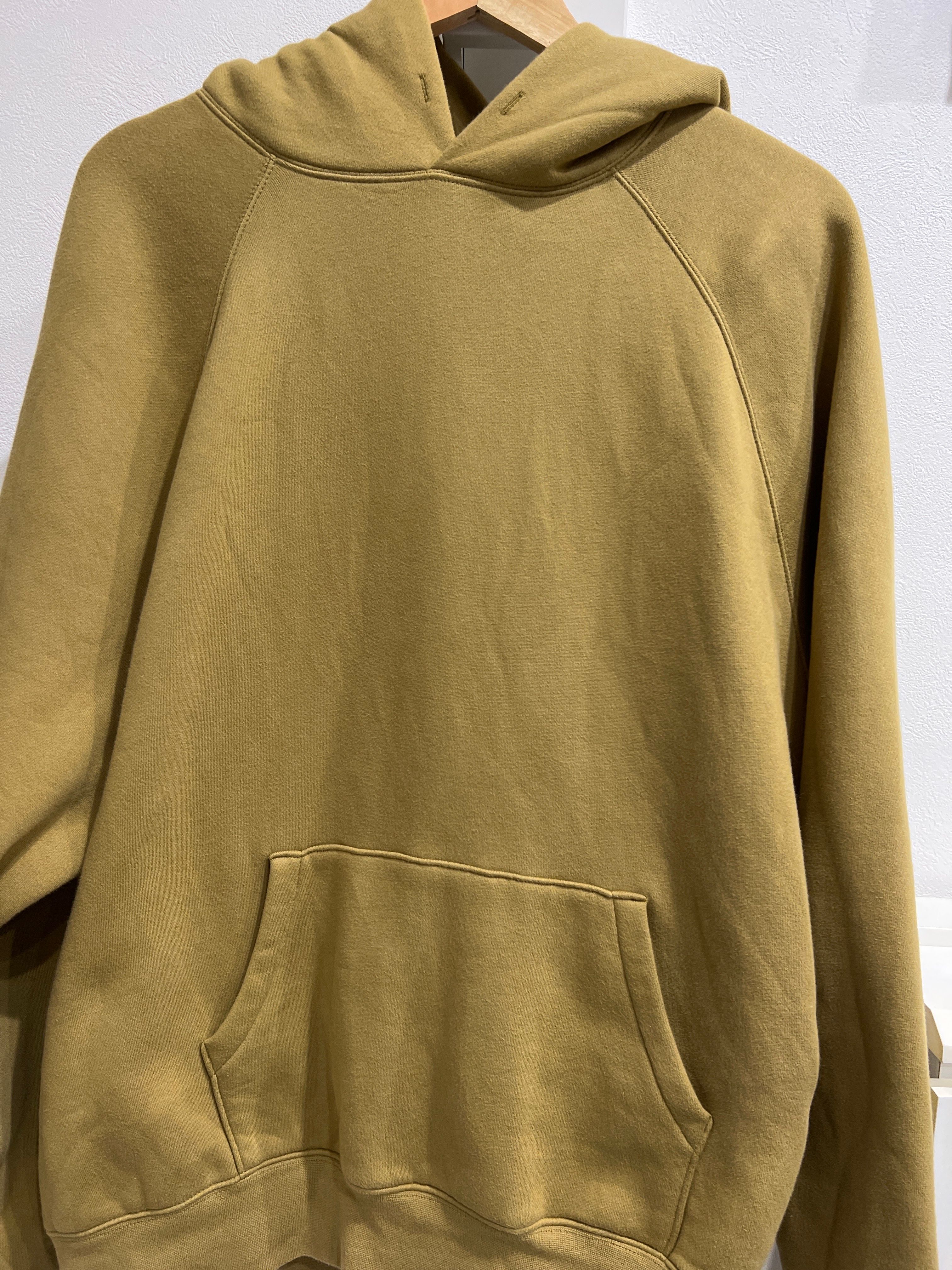 FEAR OF GOD ESSENTIALS PULLOVER HOODIE "Amber"