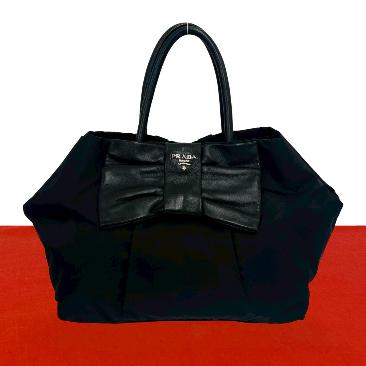 PRADA プラダ リボン ロゴ金具 ナイロン レザー ハンドバッグ ブラック
 28894