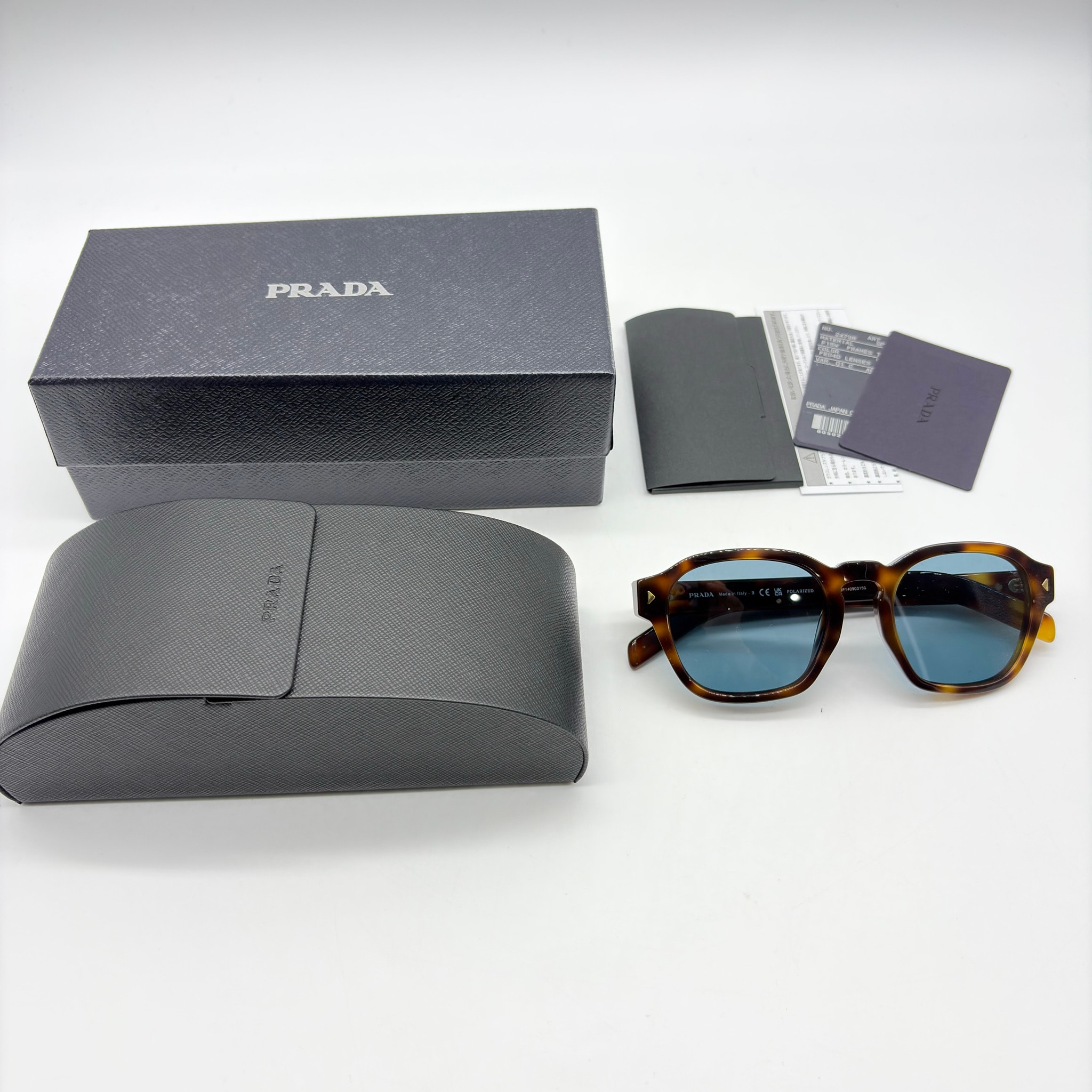 PRADA Sunglasses with the Iconic Metal Plaque "Turquoise Blue"