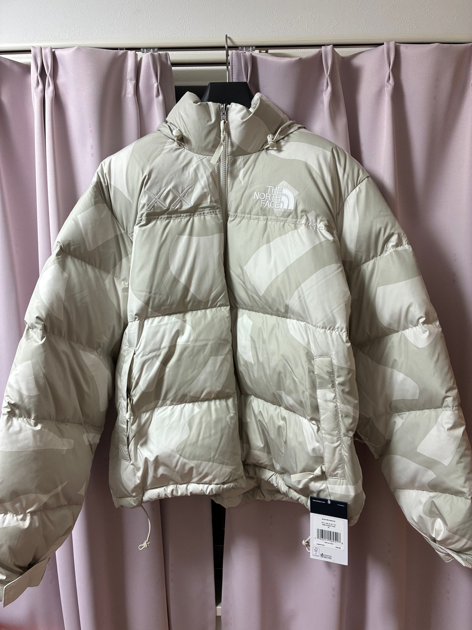 The North Face x Kaws Retro 1996 Nuptse Jacket "Moonlight Ivory"
