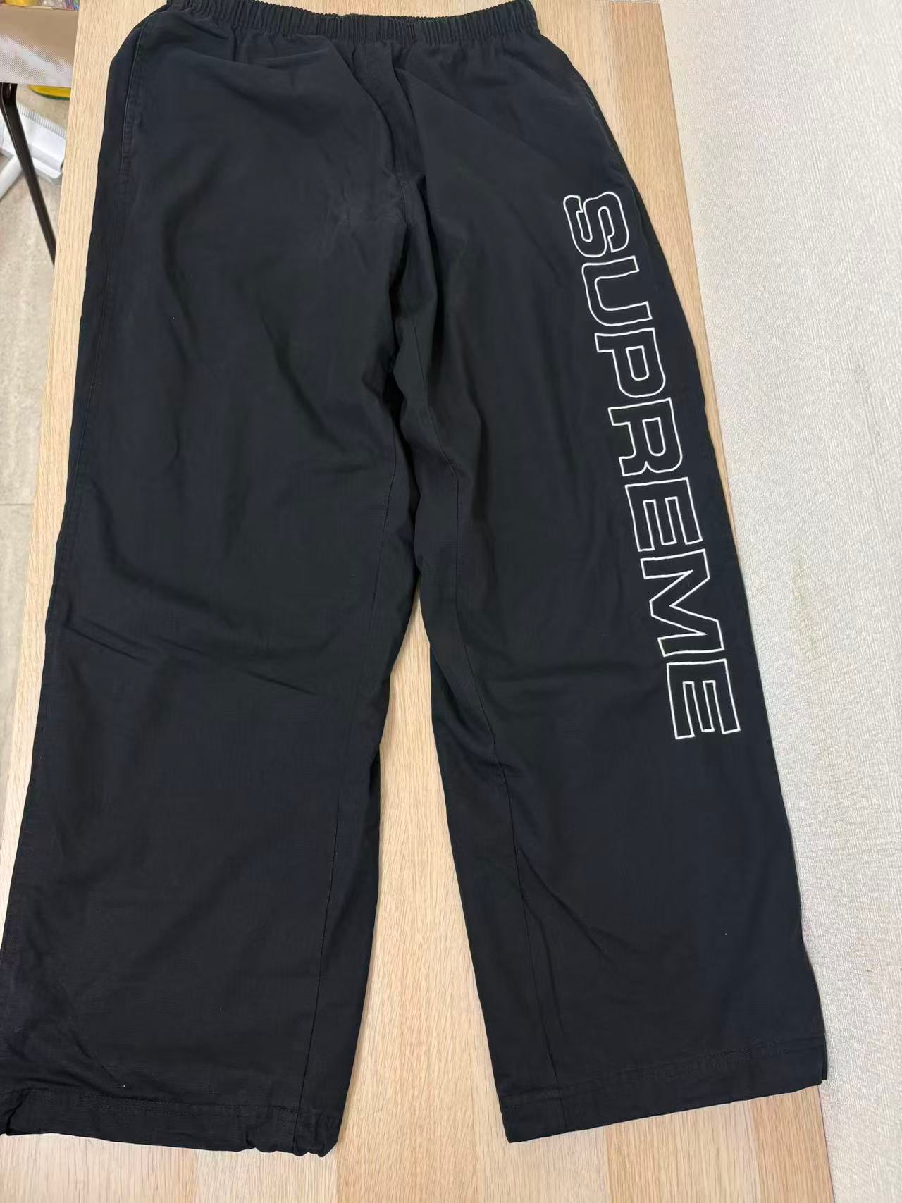 Supreme Spellout Embroidered Ripstop Track Pant "Black"