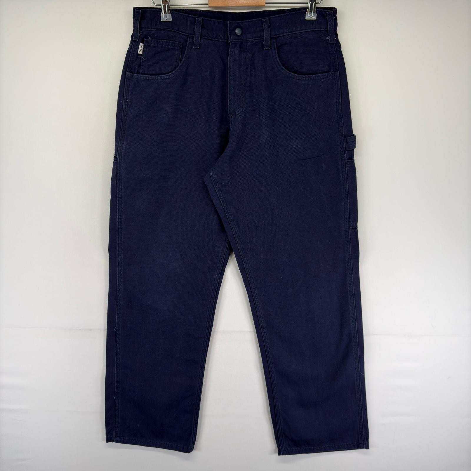 古着 カーハート Carhartt ダック パンツ ワンポイントロゴ ジッパーフライ ハンマーループ スパナポケット  ネイビー系 メンズ