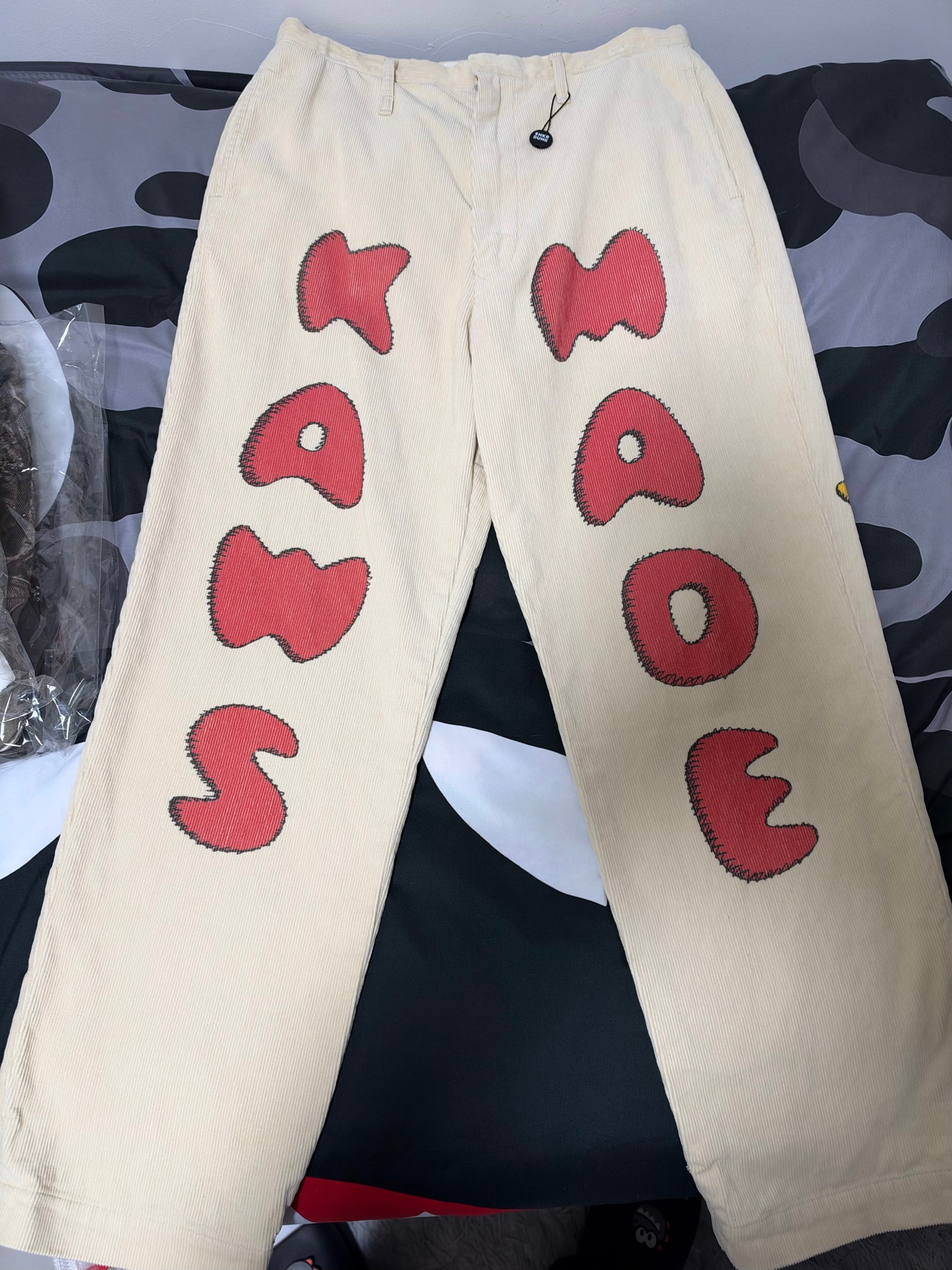 HUMAN MADE x KAWS CORDUROY PRINT PANTS "Beige"