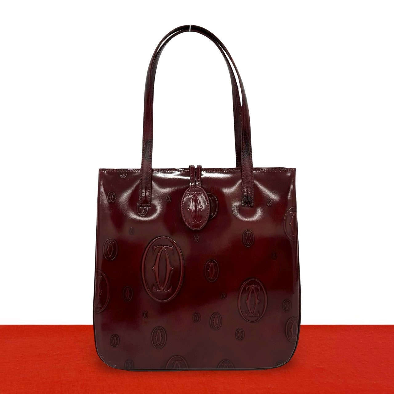 CARTIER カルティエ ハッピーバースデー ロゴ エンボス パテントレザー ハンドバッグ ワインレッド
 175-3