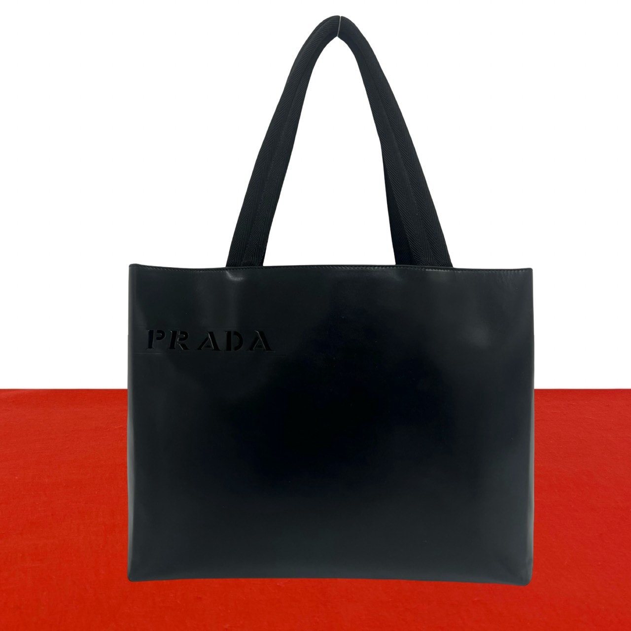 PRADA プラダ パンチング ロゴ 型抜き レザー トートバッグ ブラック
64207