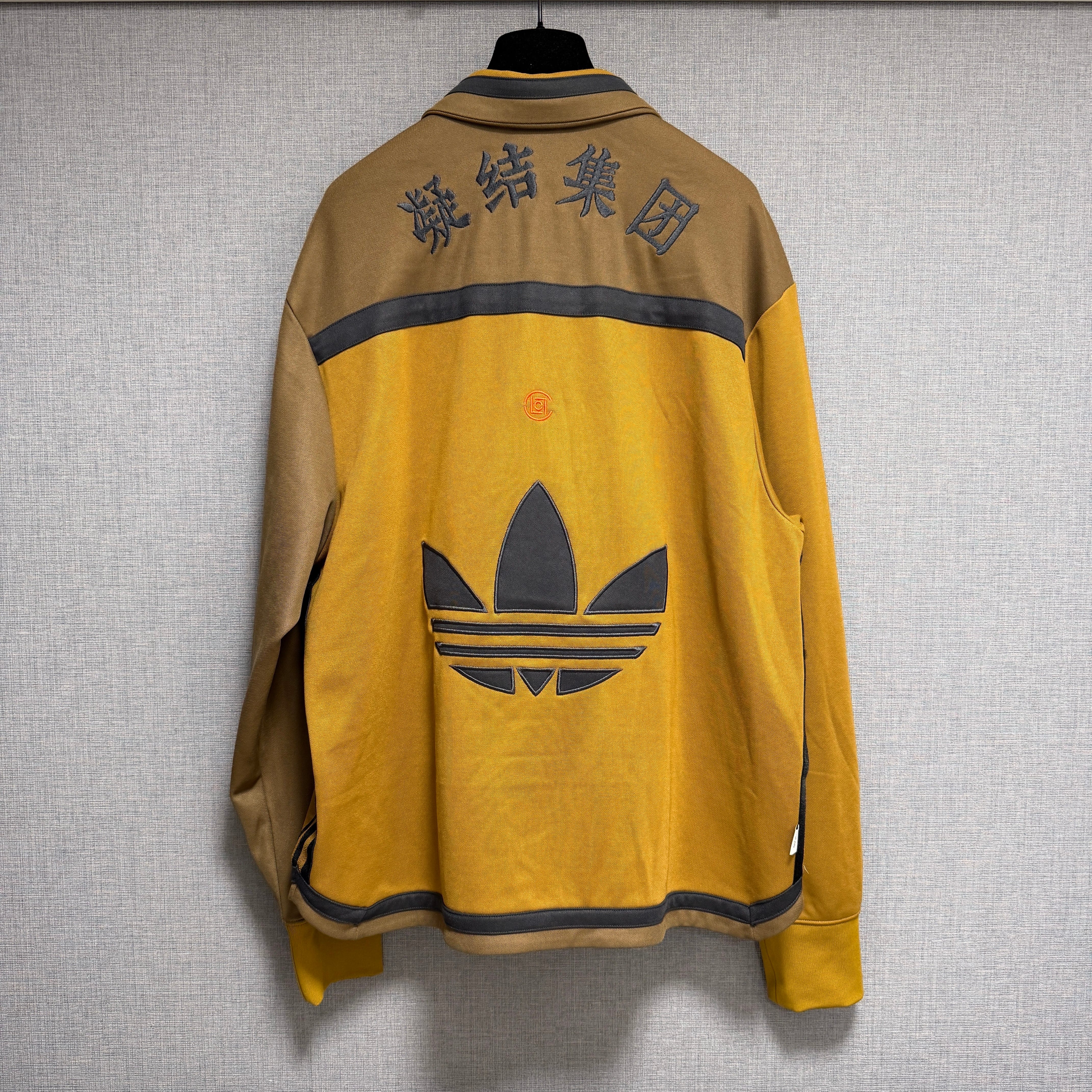 アディダス x クロット ウォームアップ ジャケット バイ エディソンチャン (ジェンダーニュートラル) "ブロンズストレータ" IY8664