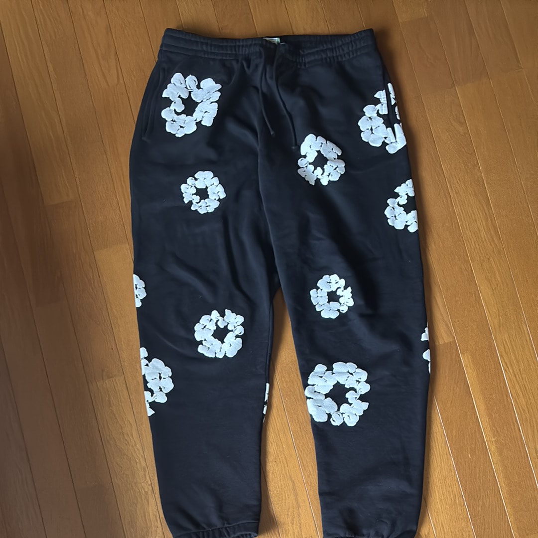 DENIM TEARS The Cotton Wreath Sweat Pants "Black"