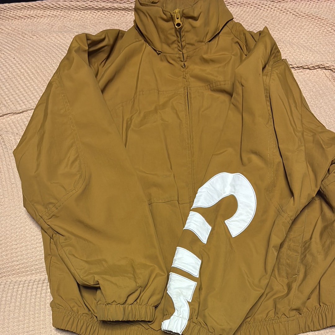 Supreme Spellout Track Jacket "Dark Gold"