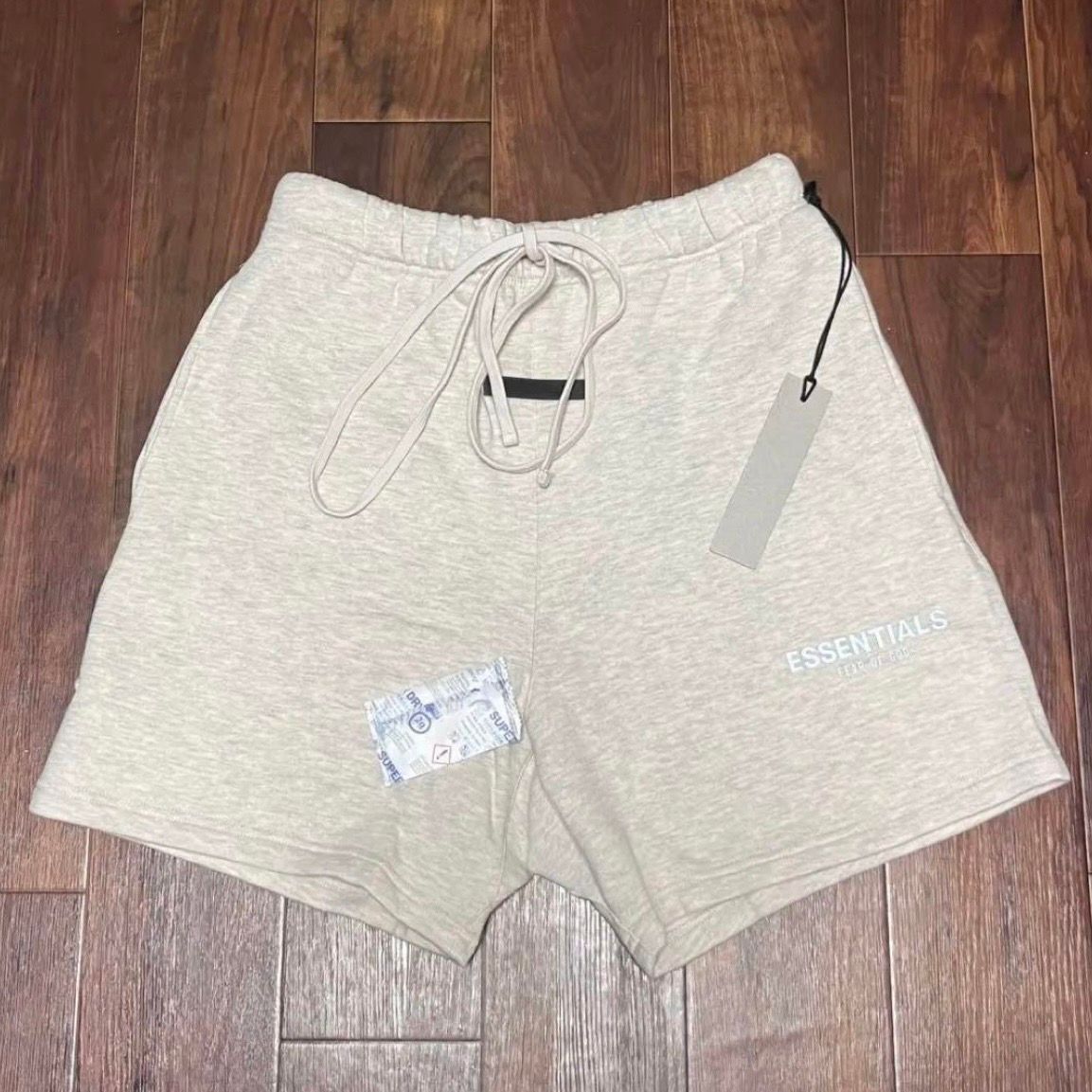 FEAR OF GOD ESSENTIALS SWEATSHORT "Light Heather Oatmeal"