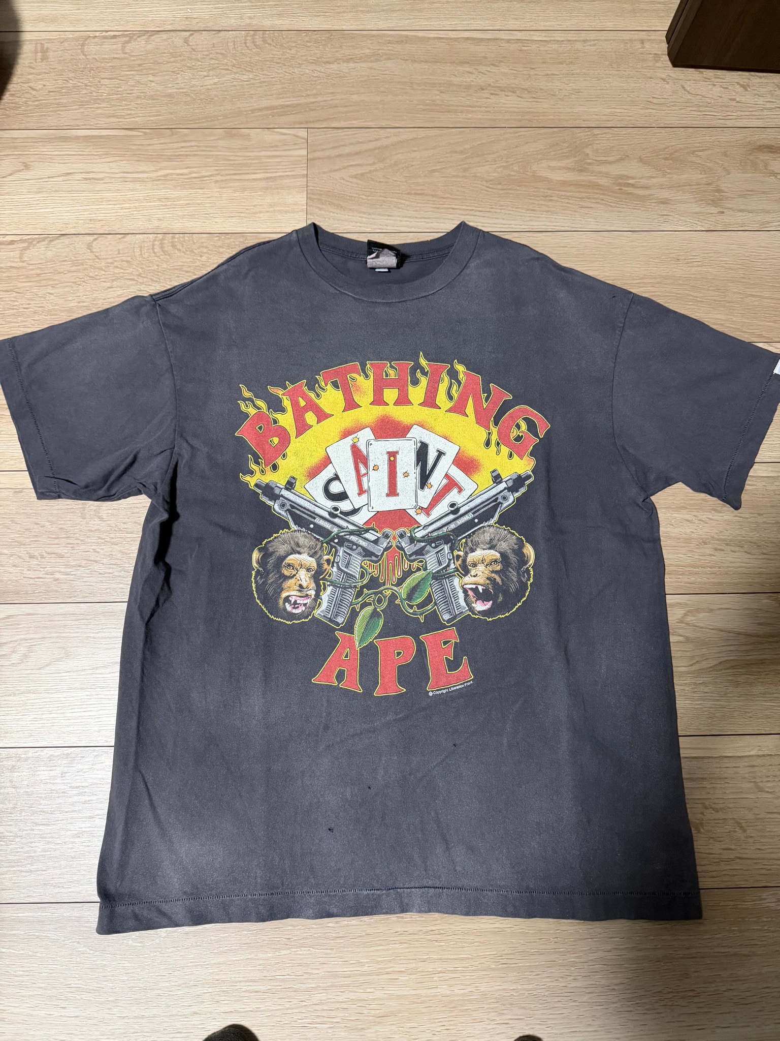 SAINT Mxxxxxx x A BATHING APE Guns Tee "Charcoal"