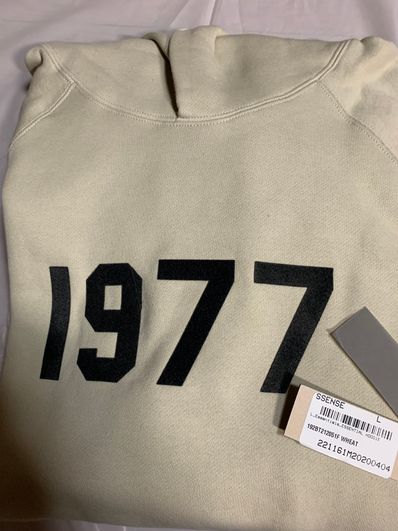 FEAR OF GOD ESSENTIALS 1977 HOODIE "Wheat"