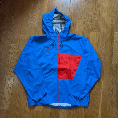 Nike ACG 2.5L Pocket Jacket LT "Photo Blue/Habanero"