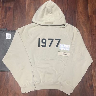 FEAR OF GOD ESSENTIALS 1977 HOODIE "Wheat"