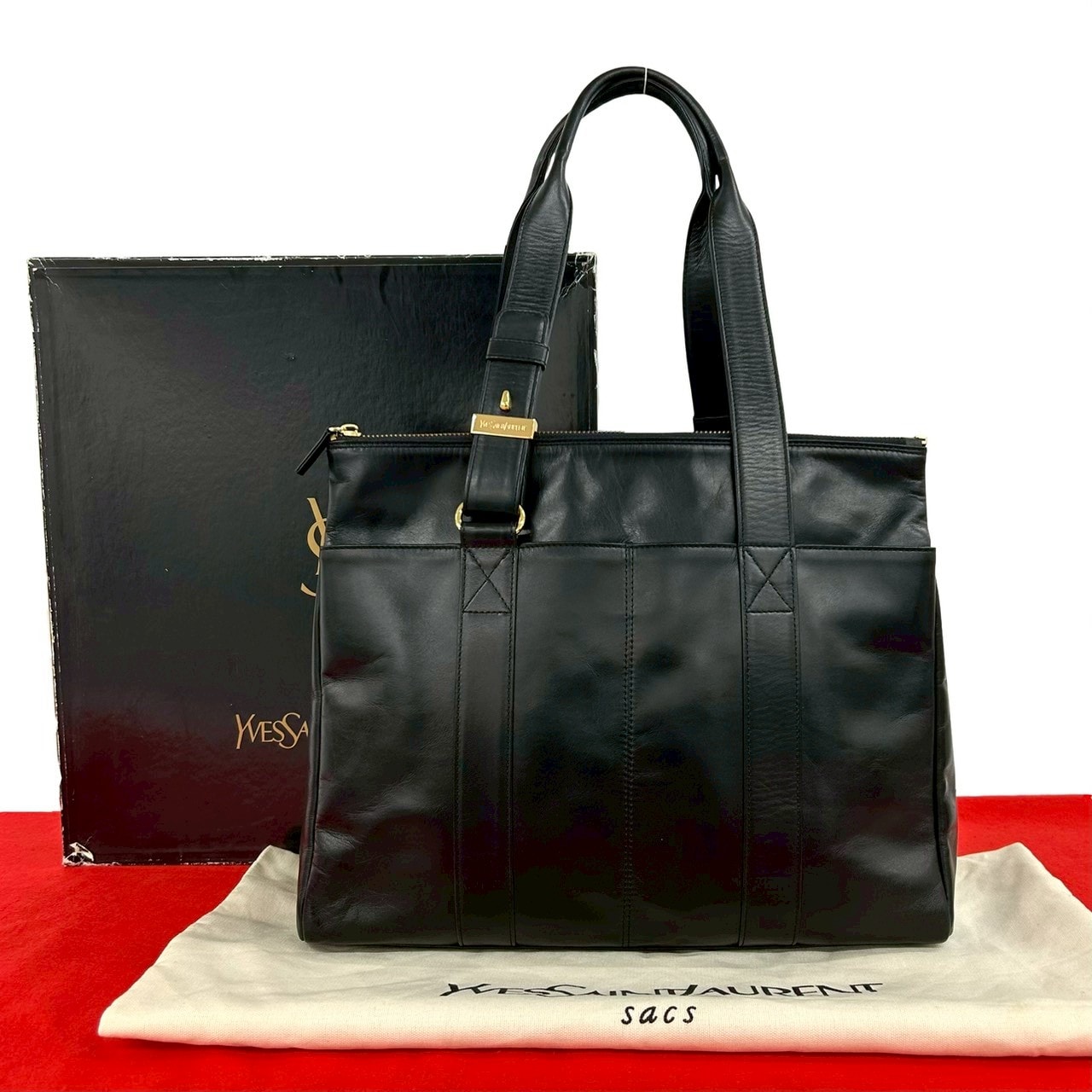 YVES SAINT LAURENT イヴ・サンローラン ロゴ 刻印 金具 レザー トートバッグ ブラック
09394