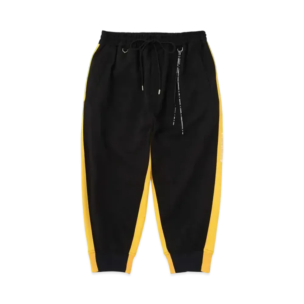 mastermind WORLD Cropped Track Pants "Black Yellow"