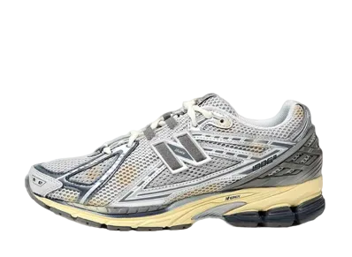 thisisneverthat × New Balance 1906R "Gray/Metallic Silver"